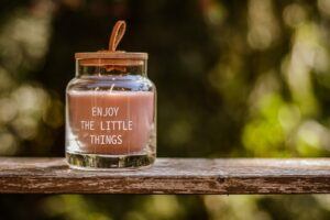 A modern scented candle in a jar.