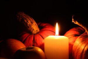 There are many cozy ways to use candles in Thanksgiving decor.